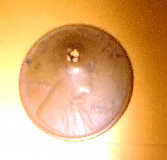 I-Have-Two-Wheat-Pennies-With-Square-Holes-Punched-In-Them.